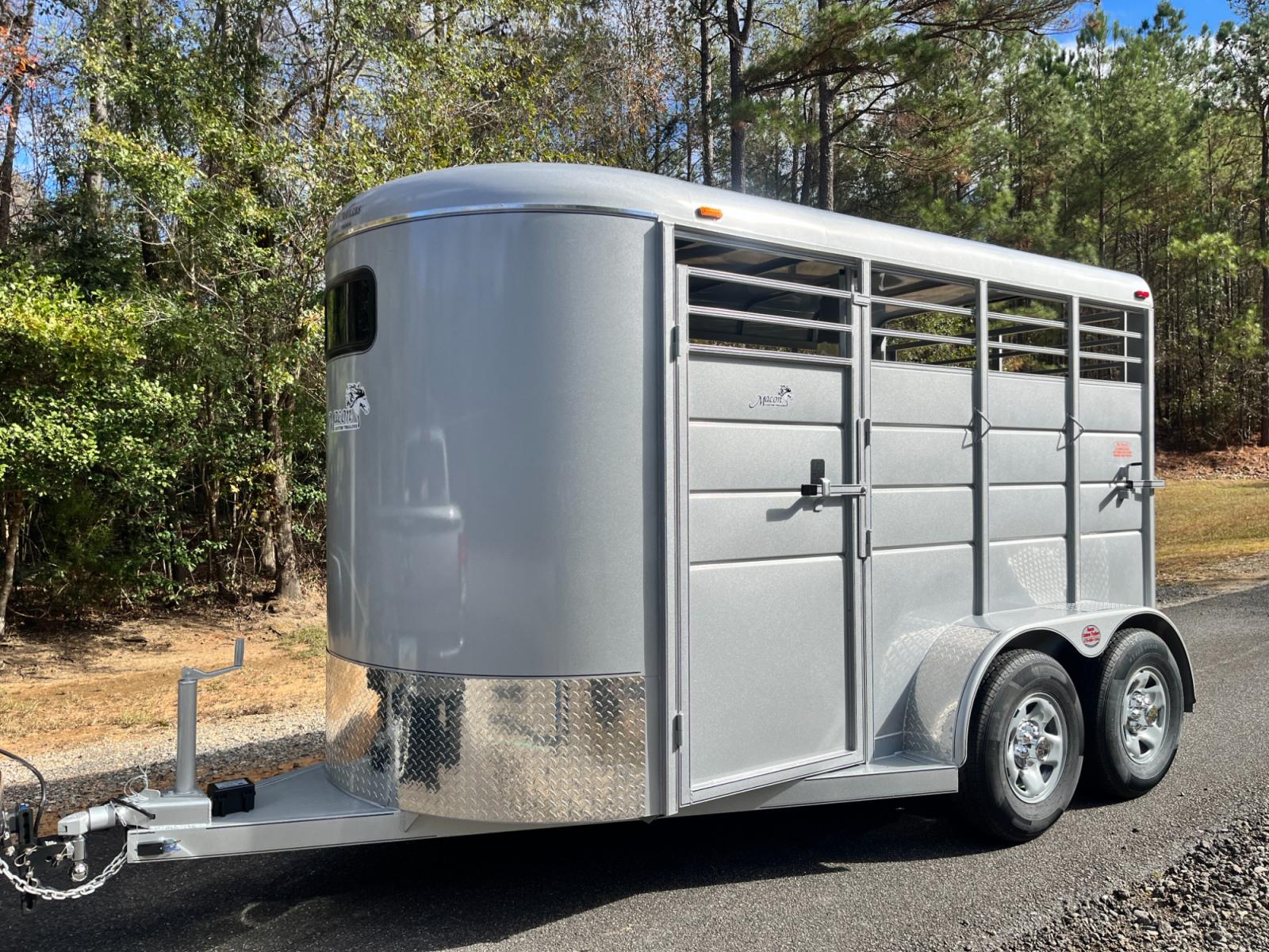 2023 Silver Metallic Calico 2 Horse Slant , located at 1330 Rainey Rd., Macon, 31220, (478) 960-1044, 32.845638, -83.778687 - Brand New 2023 Model 2 Horse Slant Calico Brand Trailer! 6ft Wide X 13ft Long Deluxe Model Tandem Axle Trailer! Easy Close Slant Divider Latch! 16" Radials! Beautiful Silver Metallic Paint is Awesome! Black Pin Striping Looks Fantastic! Fully Caulked Inside and Out to Prevent Rust! The Paint i - Photo #0