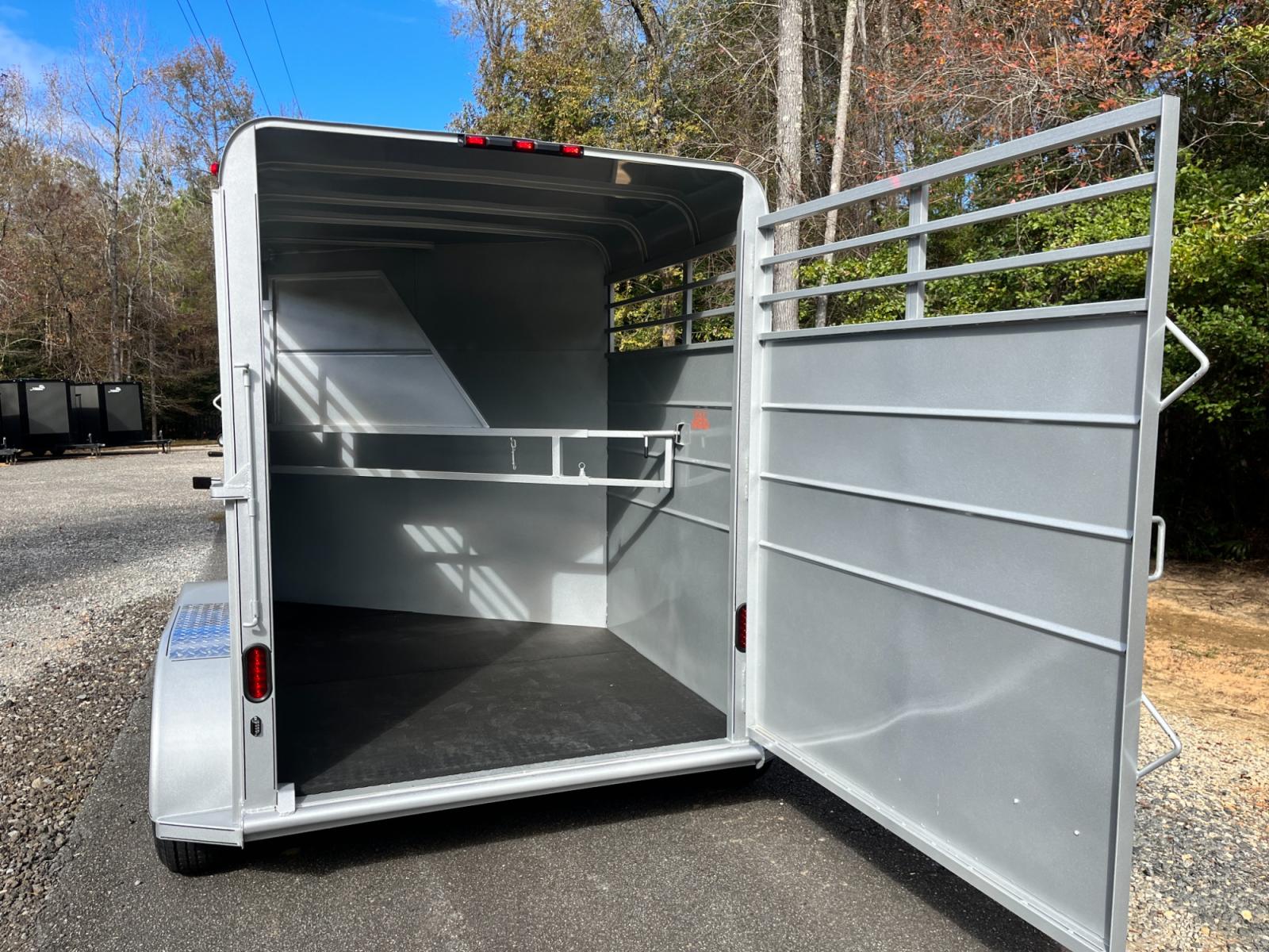 2023 Silver Metallic Calico 2 Horse Slant , located at 1330 Rainey Rd., Macon, 31220, (478) 960-1044, 32.845638, -83.778687 - Brand New 2023 Model 2 Horse Slant Calico Brand Trailer! 6ft Wide X 13ft Long Deluxe Model Tandem Axle Trailer! Easy Close Slant Divider Latch! 16