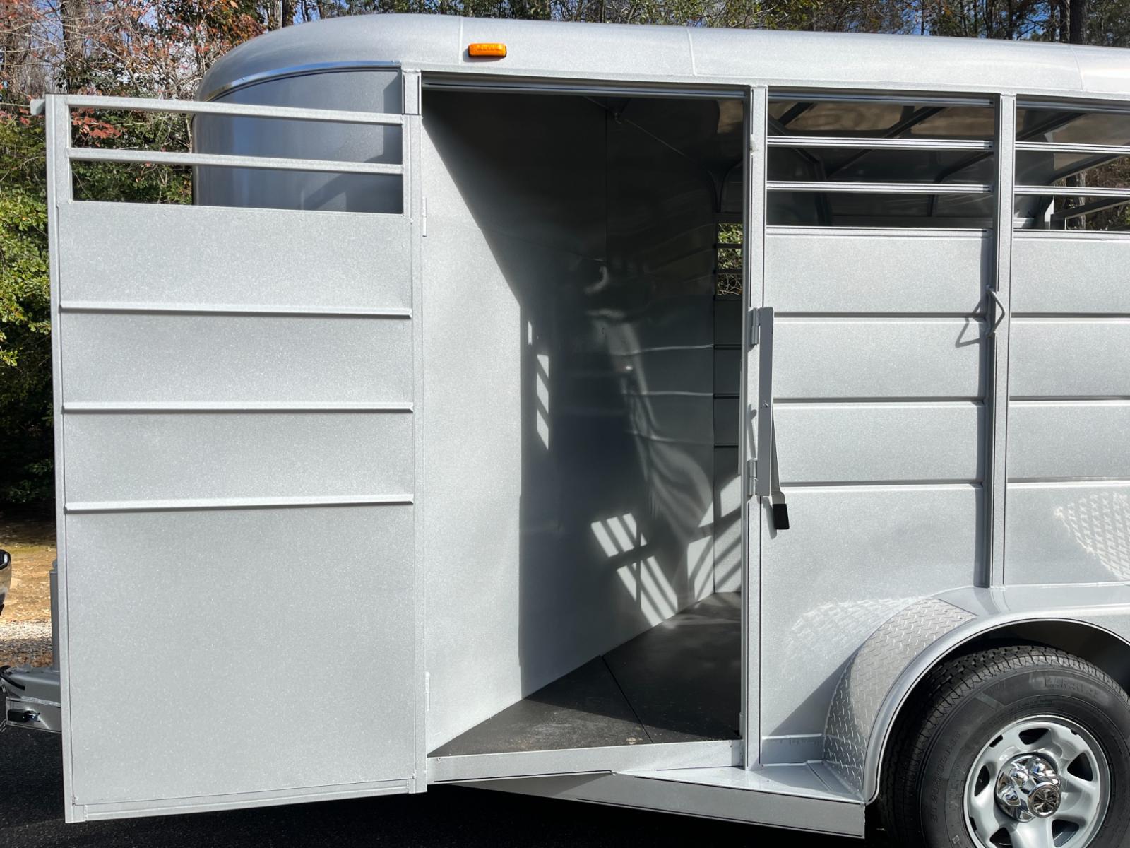 2023 Silver Metallic Calico 2 Horse Slant , located at 1330 Rainey Rd., Macon, 31220, (478) 960-1044, 32.845638, -83.778687 - Brand New 2023 Model 2 Horse Slant Calico Brand Trailer! 6ft Wide X 13ft Long Deluxe Model Tandem Axle Trailer! Easy Close Slant Divider Latch! 16" Radials! Beautiful Silver Metallic Paint is Awesome! Black Pin Striping Looks Fantastic! Fully Caulked Inside and Out to Prevent Rust! The Paint i - Photo #22