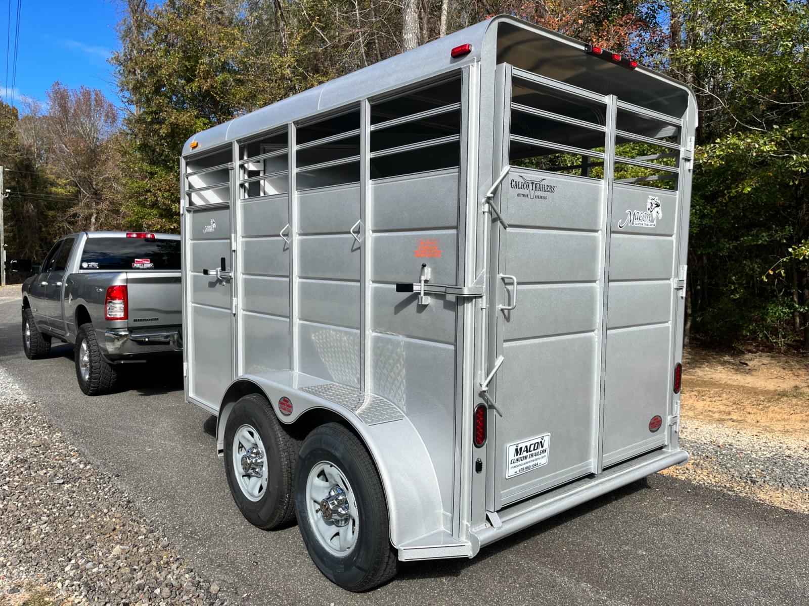 2023 Silver Metallic Calico 2 Horse Slant , located at 1330 Rainey Rd., Macon, 31220, (478) 960-1044, 32.845638, -83.778687 - Brand New 2023 Model 2 Horse Slant Calico Brand Trailer! 6ft Wide X 13ft Long Deluxe Model Tandem Axle Trailer! Easy Close Slant Divider Latch! 16" Radials! Beautiful Silver Metallic Paint is Awesome! Black Pin Striping Looks Fantastic! Fully Caulked Inside and Out to Prevent Rust! The Paint i - Photo #2